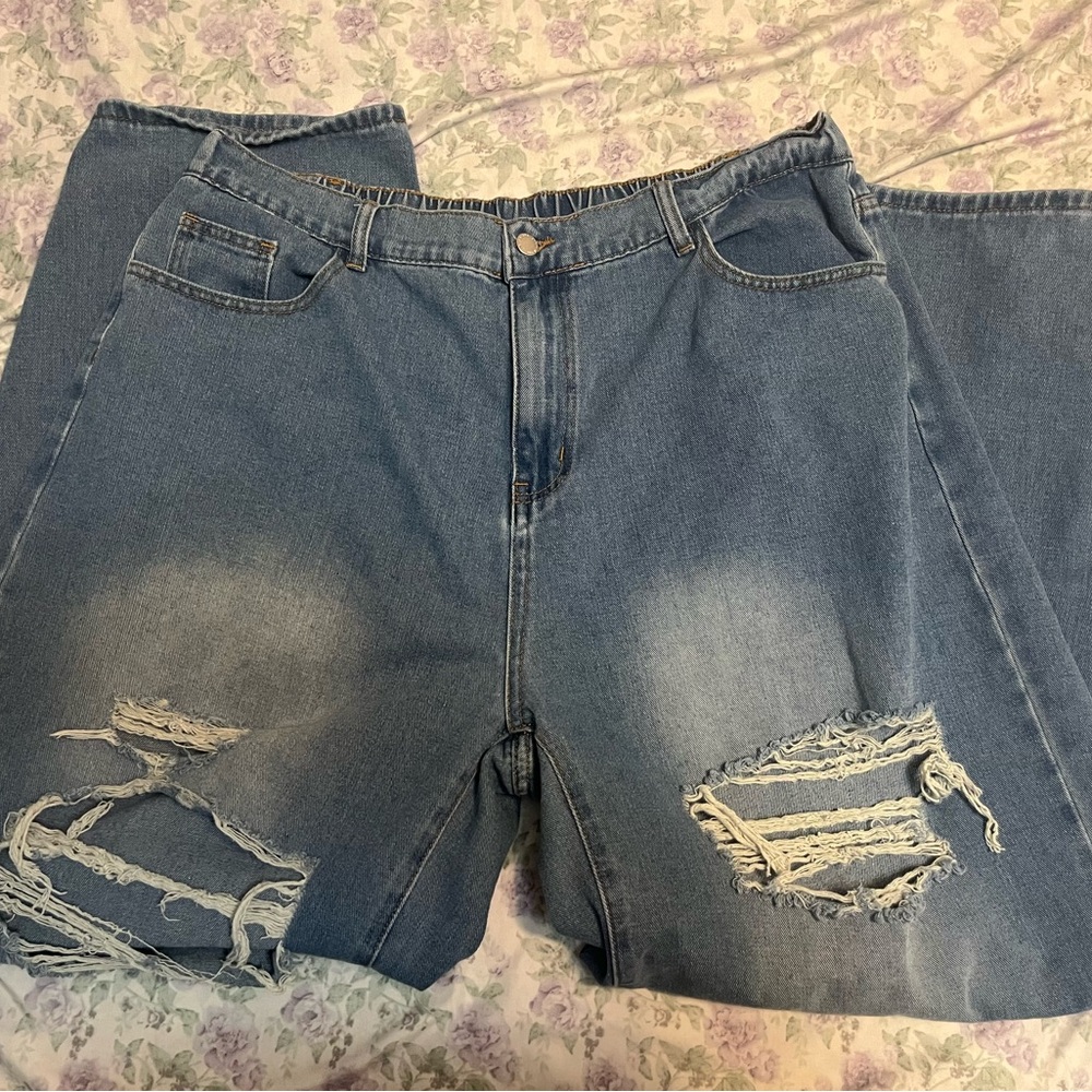 Blue and black high-waisted ripped and wide jeans